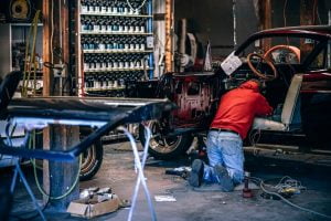 mechanic repairing driver seat